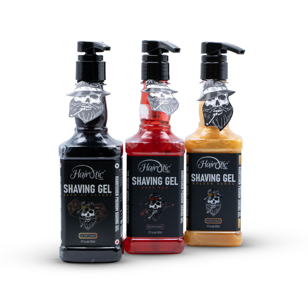 Drei Flaschen Hairotic Shaving Gel in den Varianten Jack of Spades (schwarz), Code Red (rot) und Golden Sands (gold) mit Pumpspender und auffälligem Totenkopf-Design.