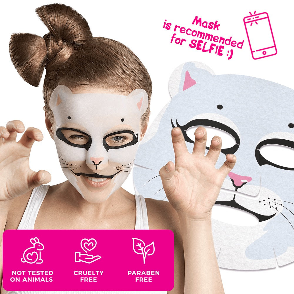 rau trägt eine weiße Tier-Gesichtsmaske im Katzen-Design mit rosa Details und posiert spielerisch mit Katzen-Geste; daneben die abgelegte Maske, darunter Symbole für „Not tested on animals“, „Cruelty free“ und „Paraben free“.