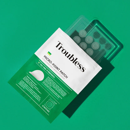 Troubless Micro-Point Patch – weiße und grüne Verpackung mit Folie der Patches auf grünem Hintergrund